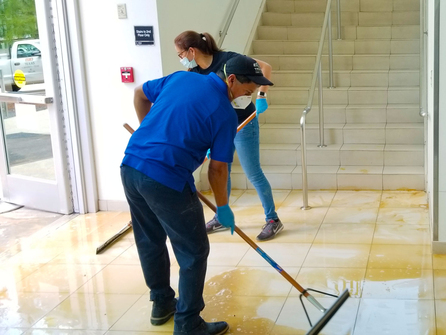 Sweeping Water and Mud from the Hall